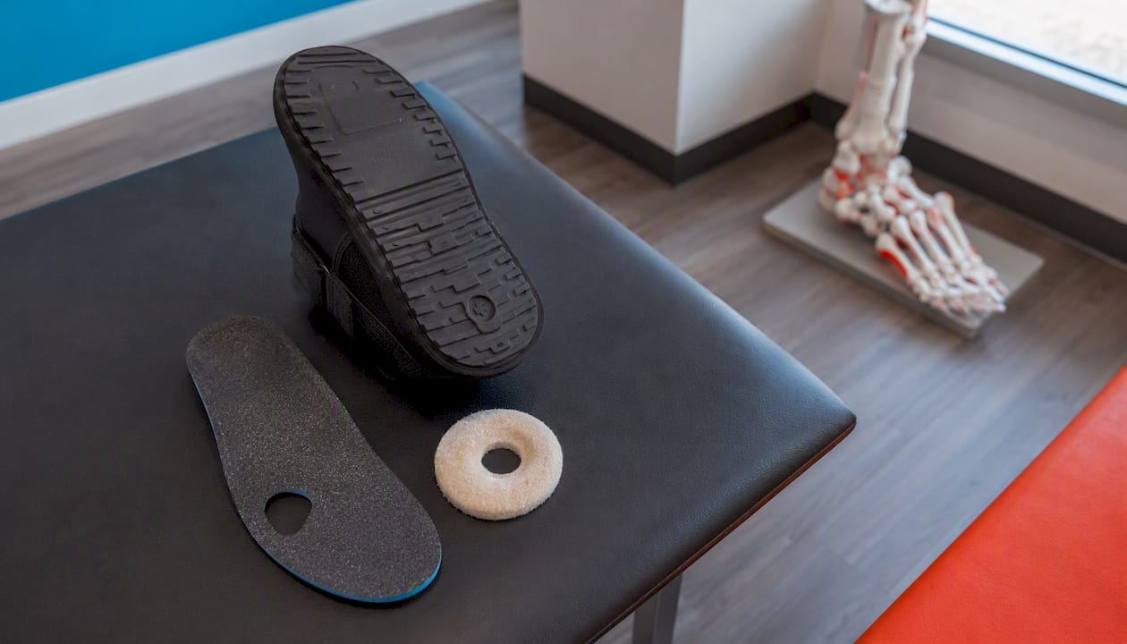 Orthopedic shoe and felt metatarsal pad close-up