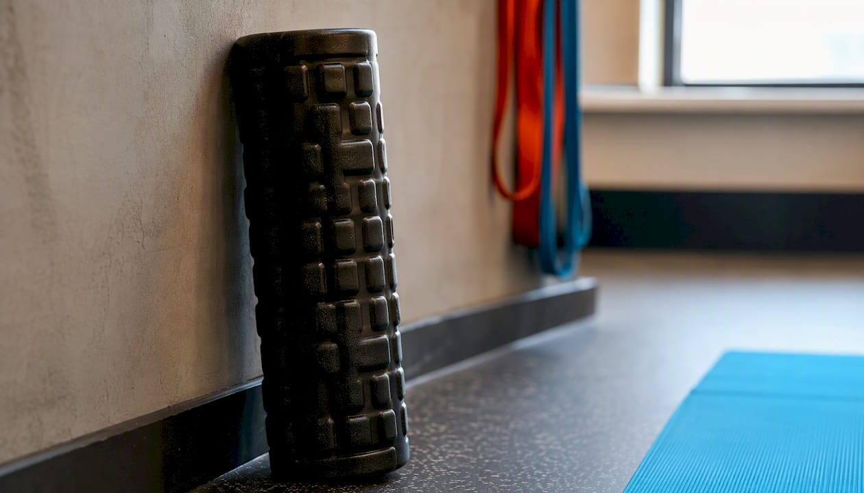 Foam roller positioned for thoracic extension