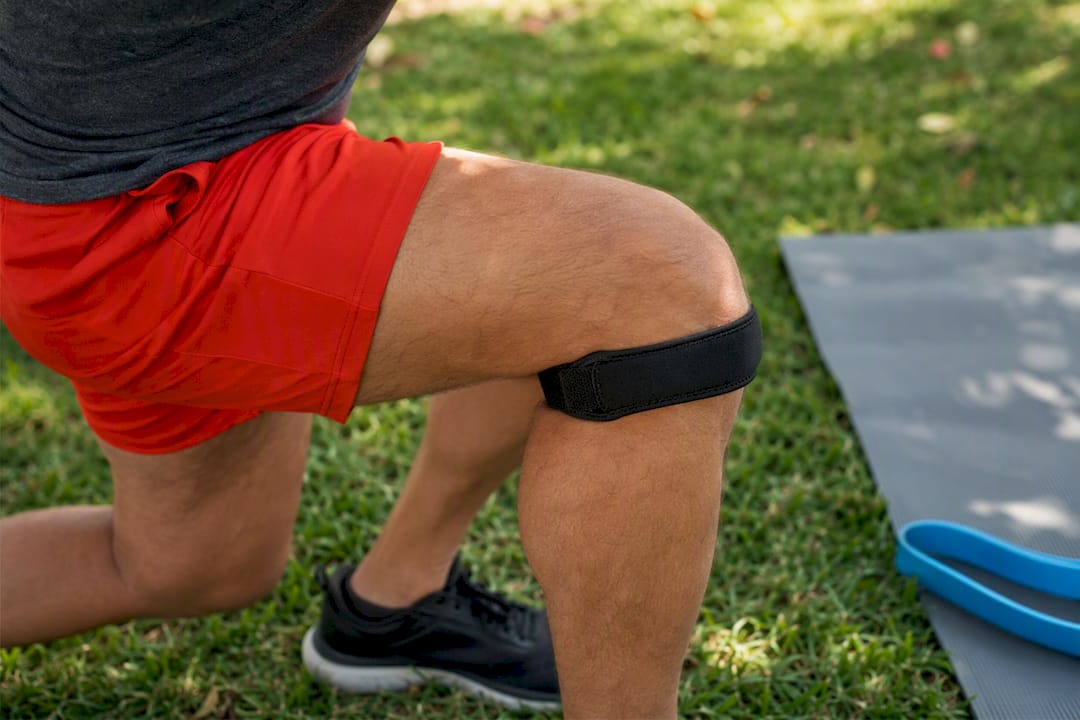 Knee with patellar strap in squat