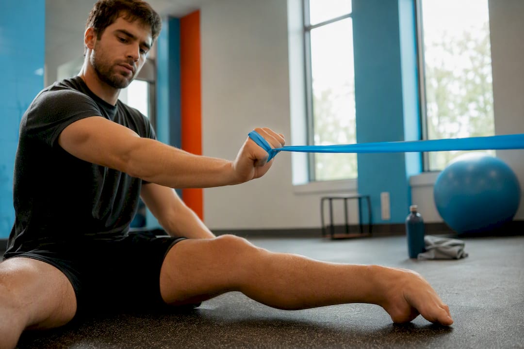 Patient performing elbow resistance band exercise