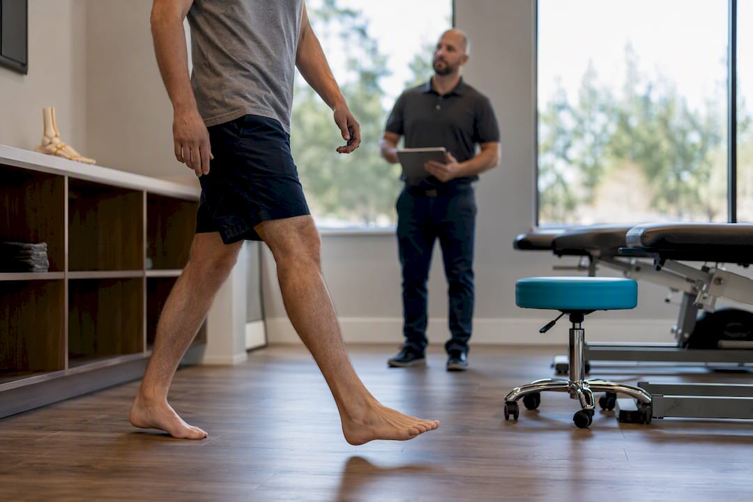 Clinician observing patient walking pattern